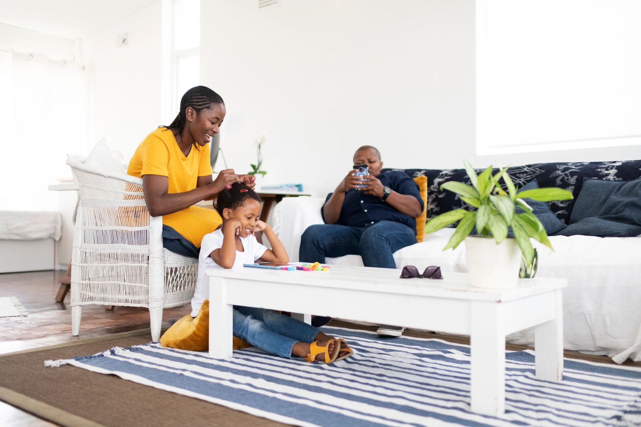 Black family together in a warm living room