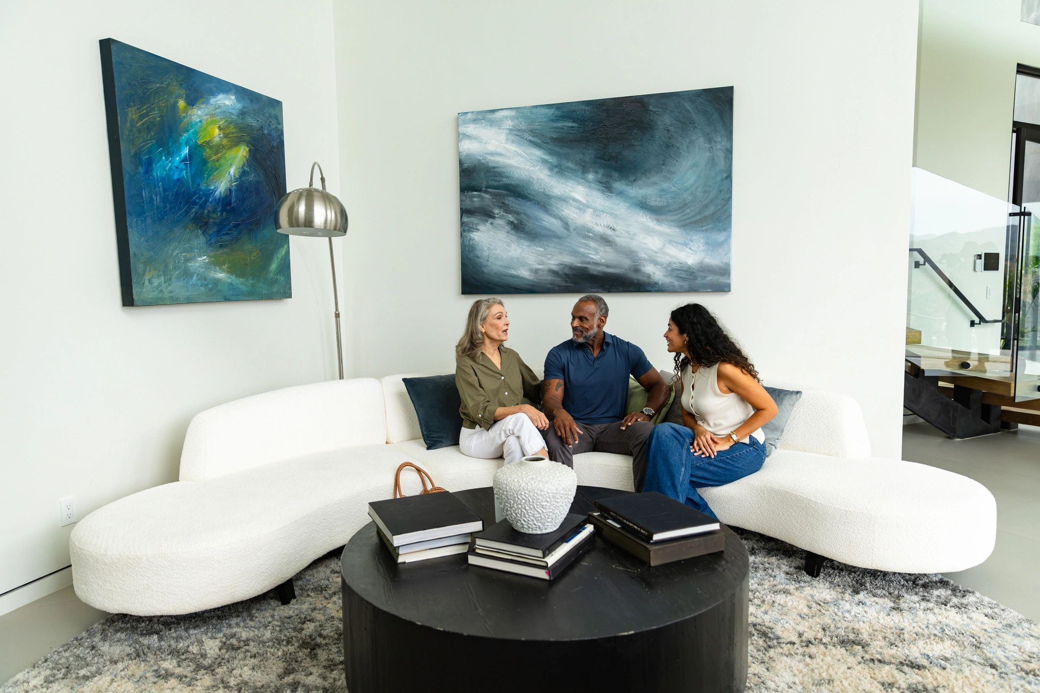 Black family talking together in a bright living room